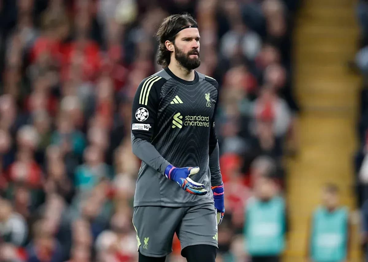 Goalkeeper Alisson Becker walking on the pitch Goalkeeper Alisson Becker walking on the pitch