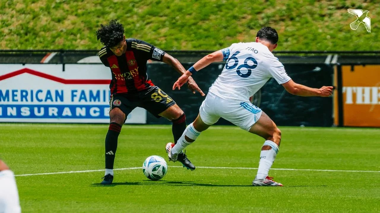 Player tackling opponent during MLS Next Pro match Player tackling opponent during MLS Next Pro match