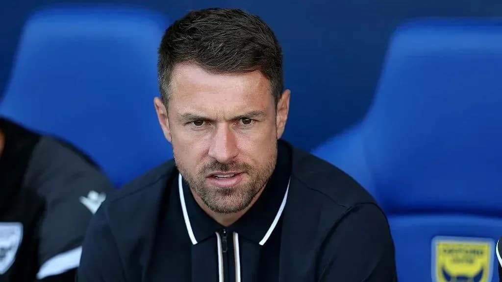 Manager seated on bench during match Manager seated on bench during match