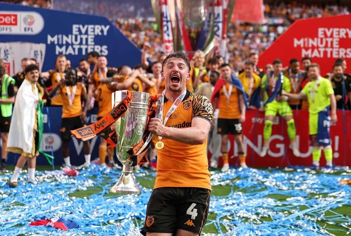 Player celebrating with trophy after championship victory Player celebrating with trophy after championship victory