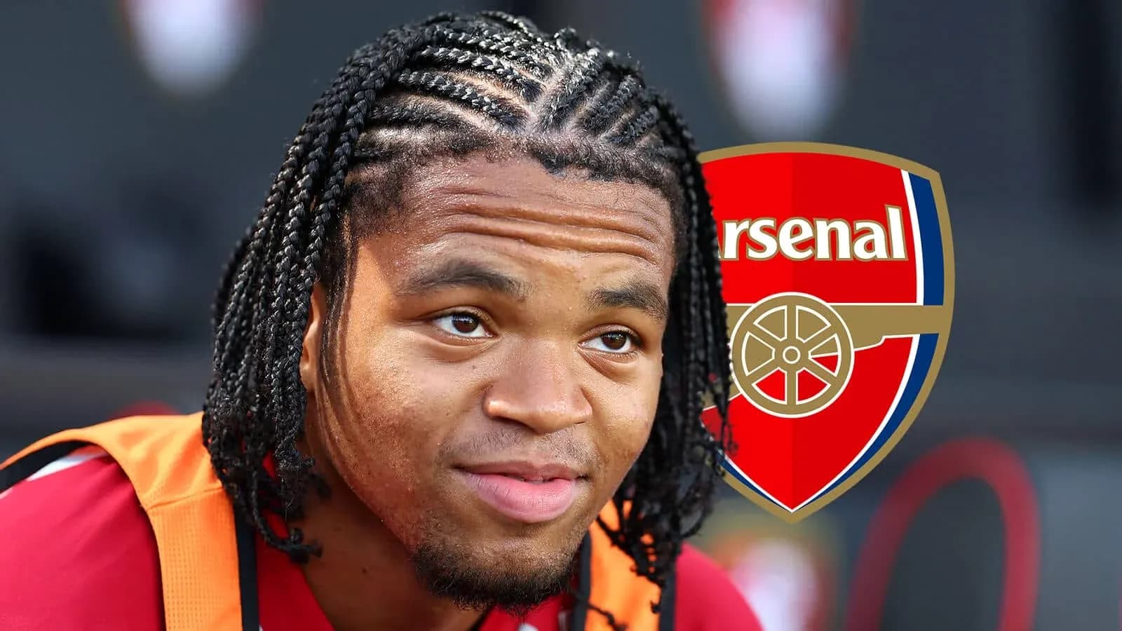 Player with braided hair near Arsenal logo Player with braided hair near Arsenal logo