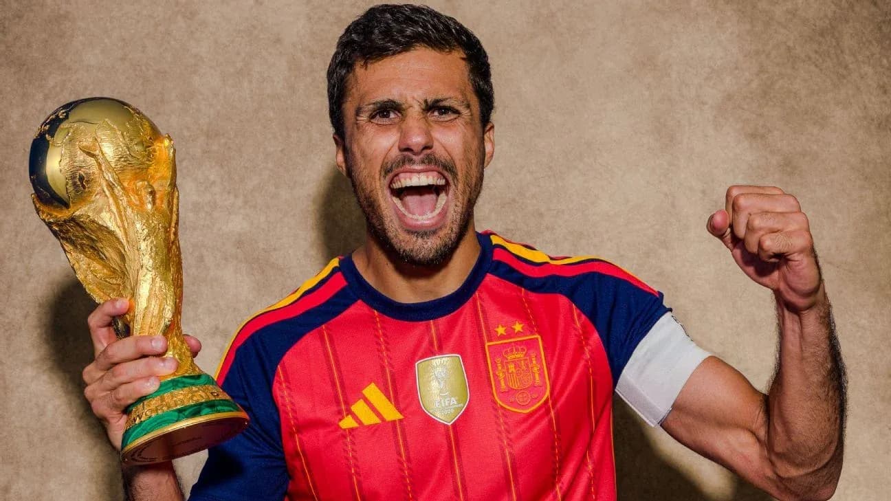 Player celebrating with FIFA World Cup trophy Player celebrating with FIFA World Cup trophy
