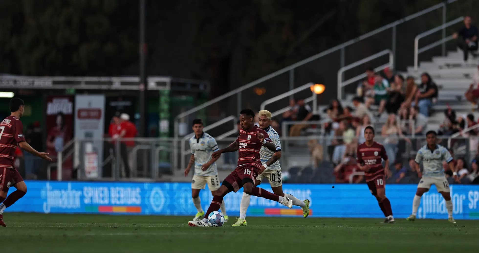 Players competing for the ball in USL Championship Players competing for the ball in USL Championship