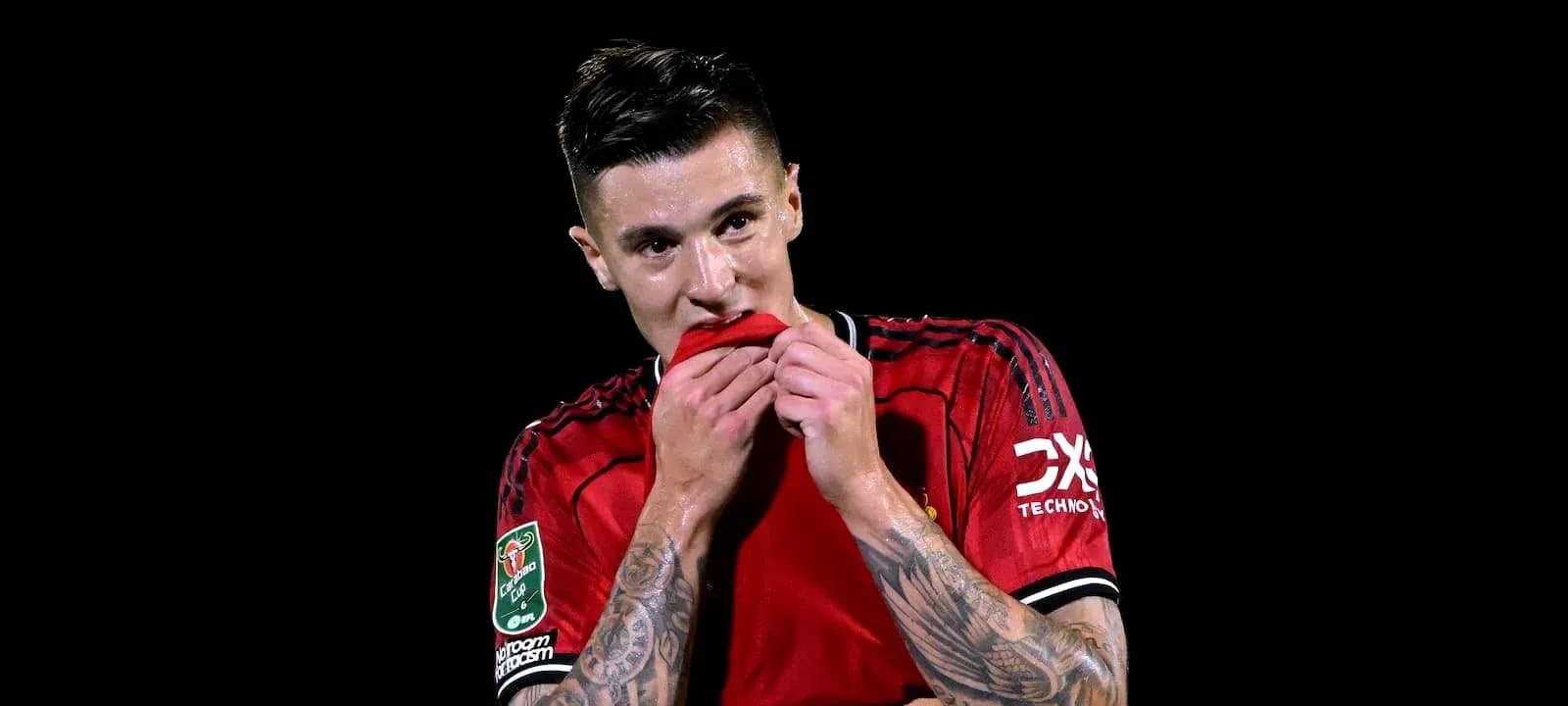 Player in red jersey biting shirt after match Player in red jersey biting shirt after match