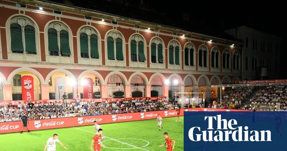 Players competing in Coca-Cola Cup match at night Players competing in Coca-Cola Cup match at night