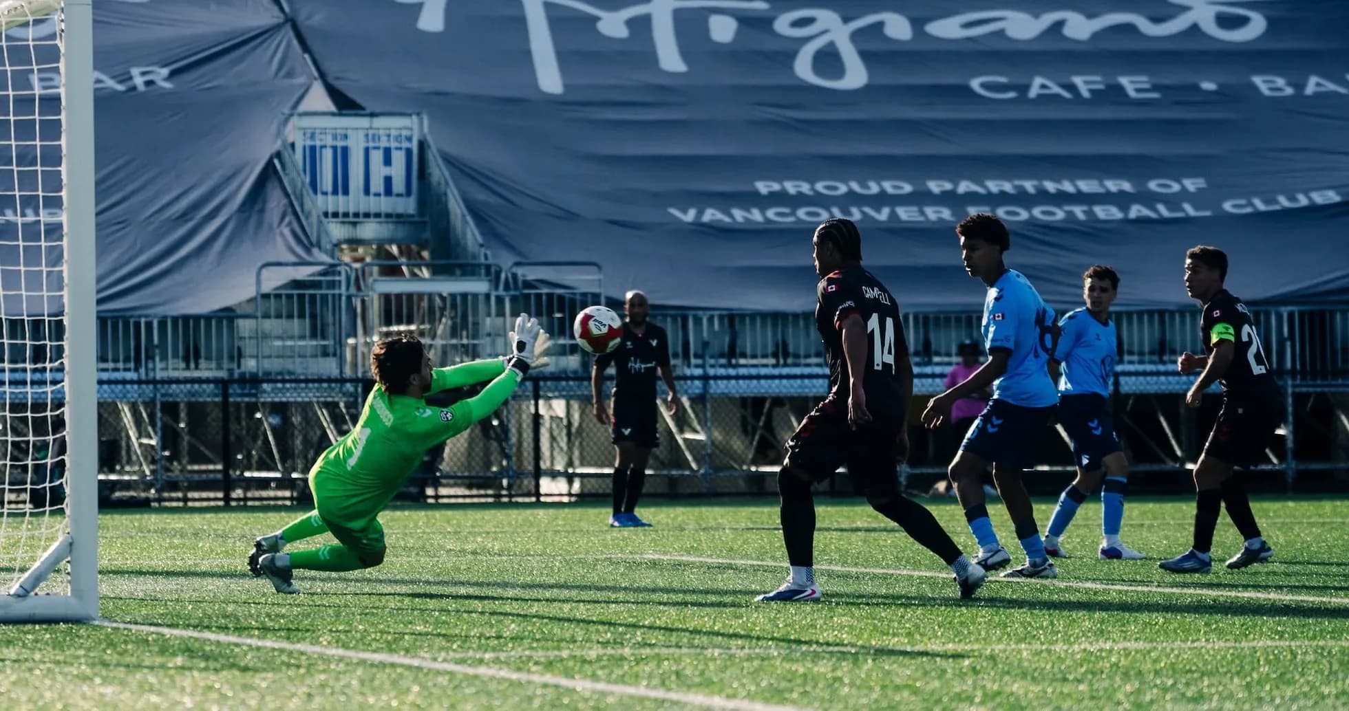 Goalkeeper diving to save a penalty kick Goalkeeper diving to save a penalty kick