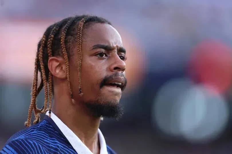 Player with braided hair during a match Player with braided hair during a match
