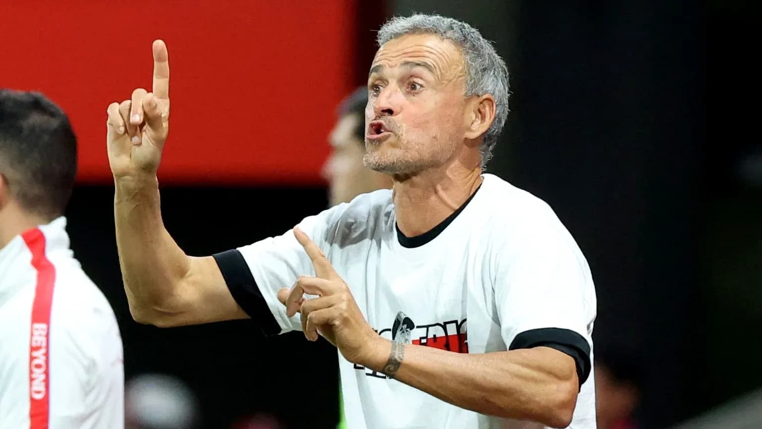 Coach gesturing during a match from the sidelines Coach gesturing during a match from the sidelines