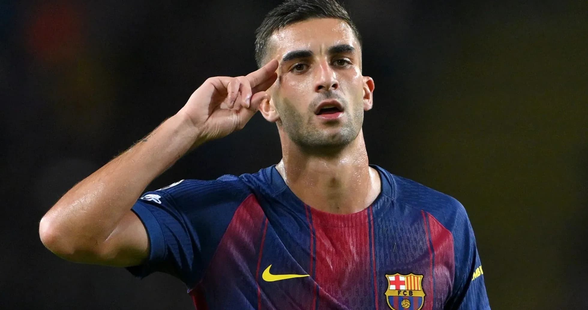Player saluting after scoring a goal for Barcelona Player saluting after scoring a goal for Barcelona
