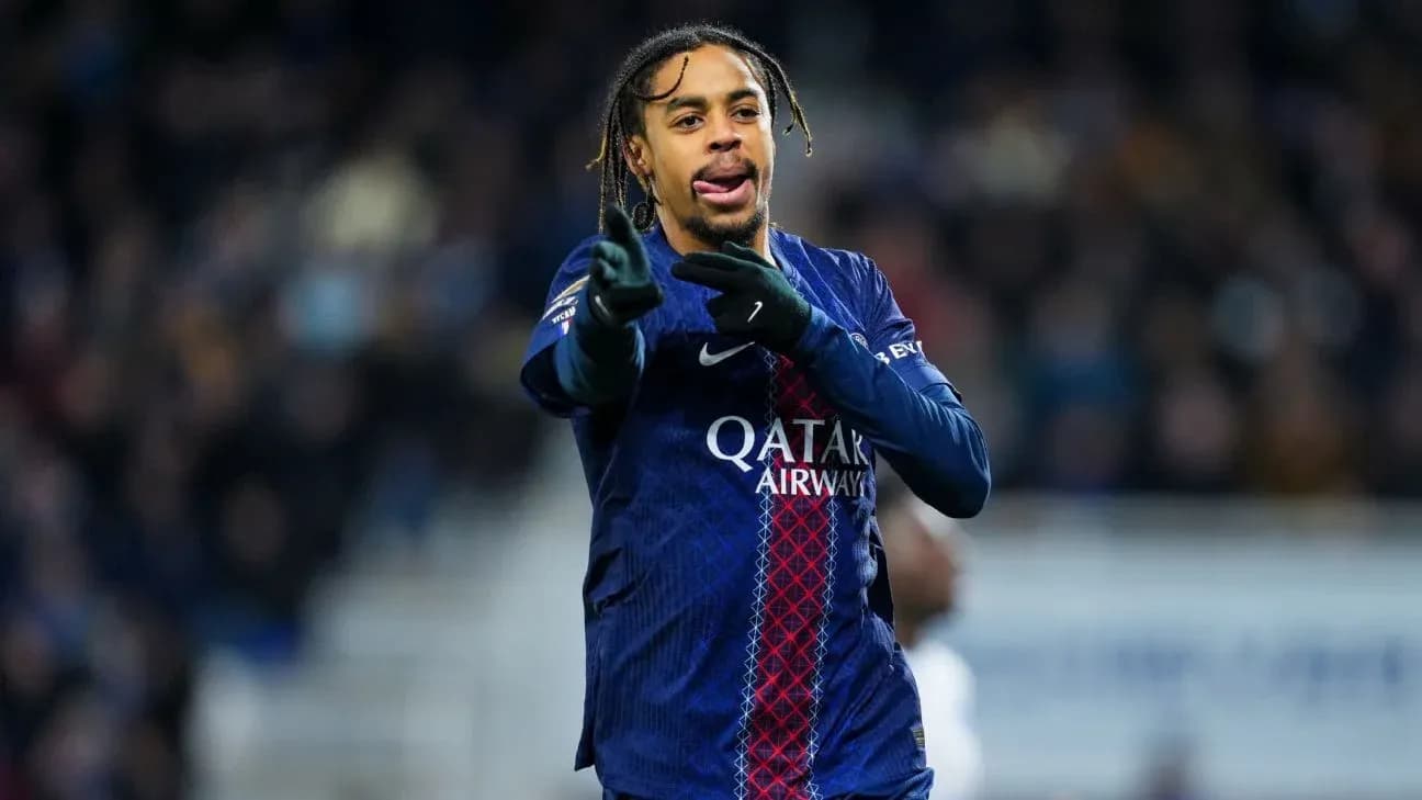 Player gesturing during match wearing PSG jersey Player gesturing during match wearing PSG jersey