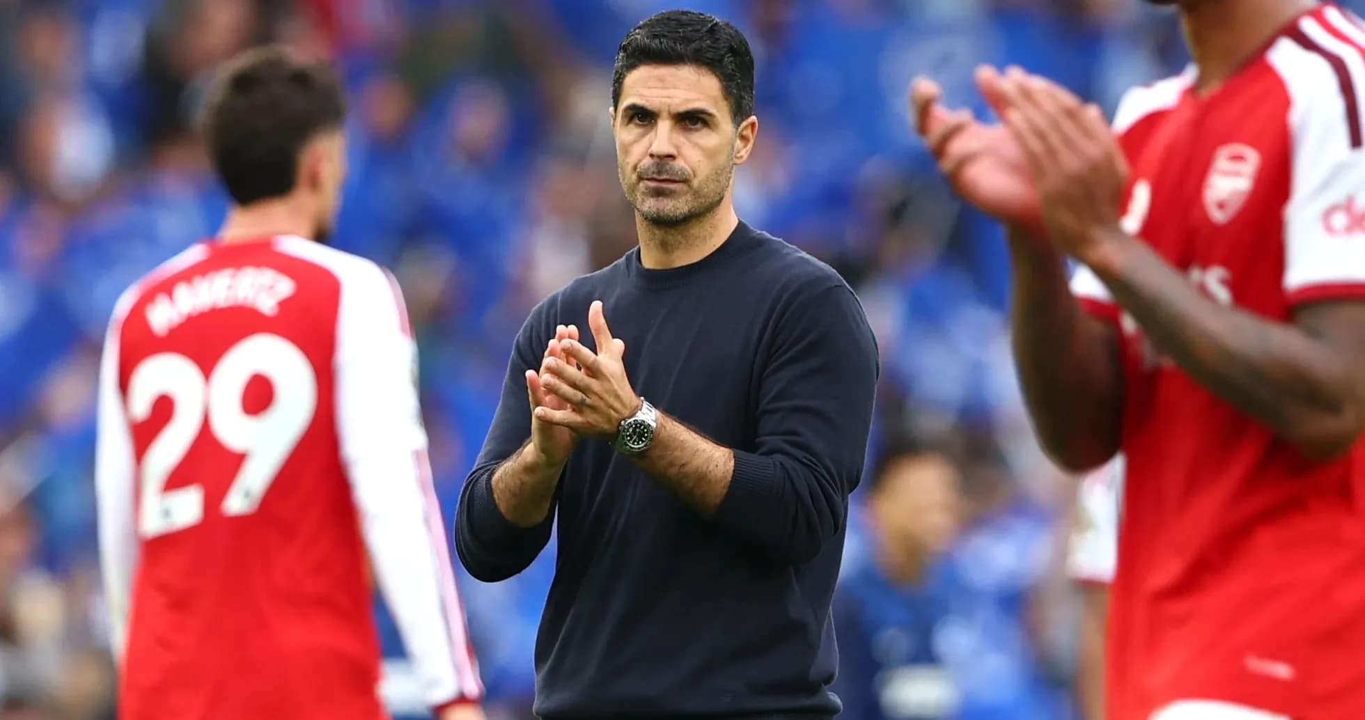 Arsenal manager clapping on the sidelines during match Arsenal manager clapping on the sidelines during match