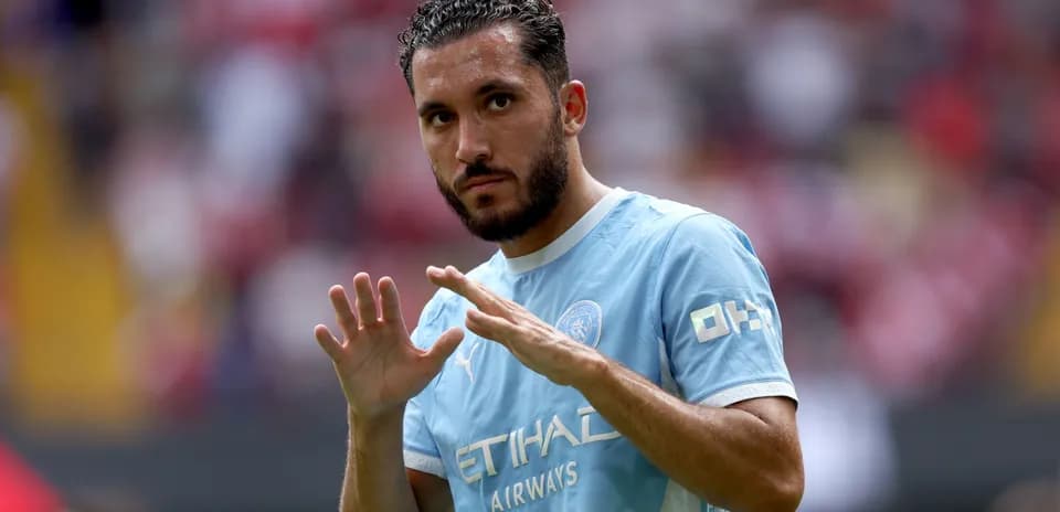 Player gesturing during warm-up in blue jersey Player gesturing during warm-up in blue jersey