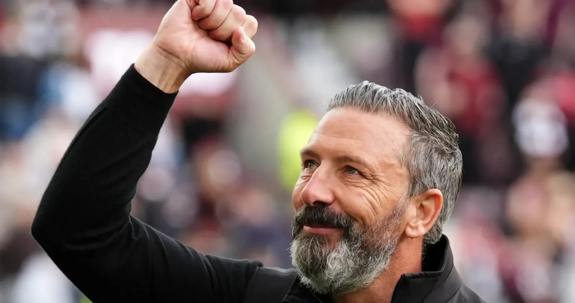 Coach celebrating with raised fist after match Coach celebrating with raised fist after match