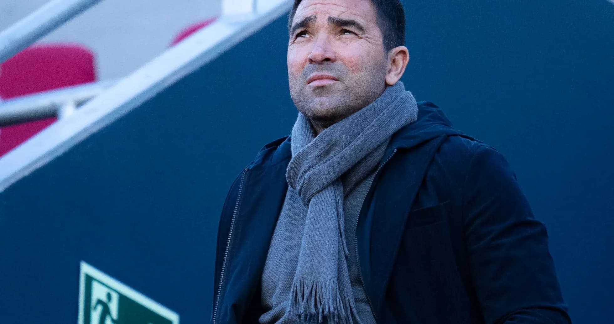 Man looking up, wearing a scarf and jacket Man looking up, wearing a scarf and jacket