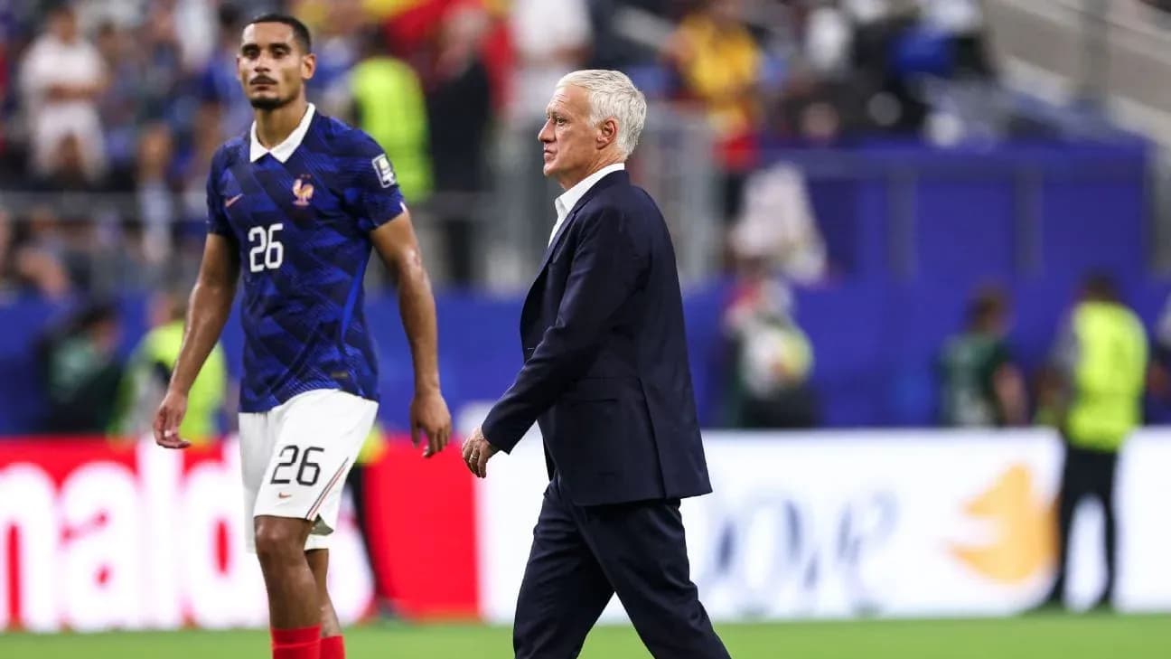 France coach Didier Deschamps walking past player France coach Didier Deschamps walking past player