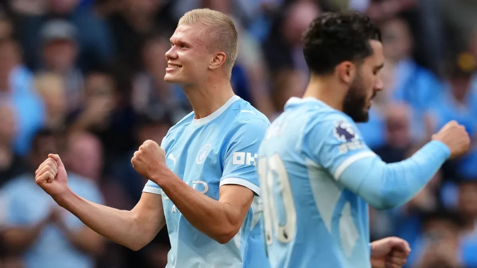 Player celebrating a goal with teammates in match Player celebrating a goal with teammates in match