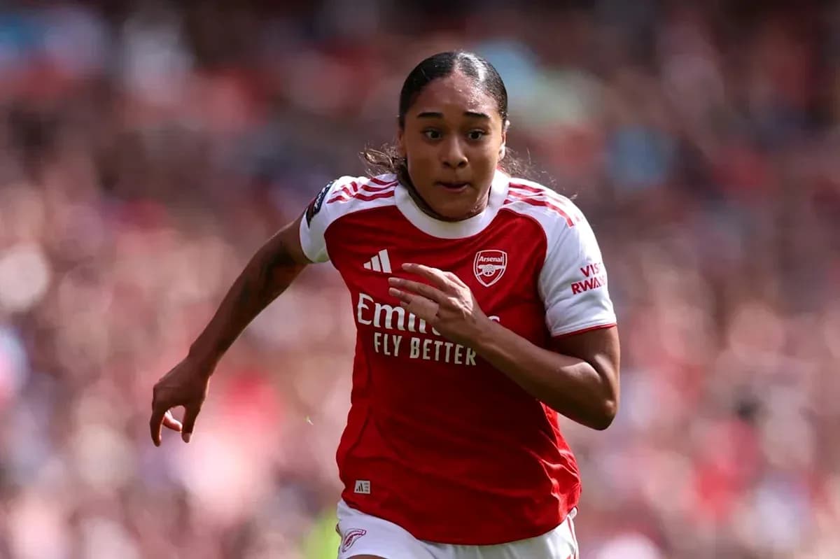 Arsenal player sprinting during a match Arsenal player sprinting during a match