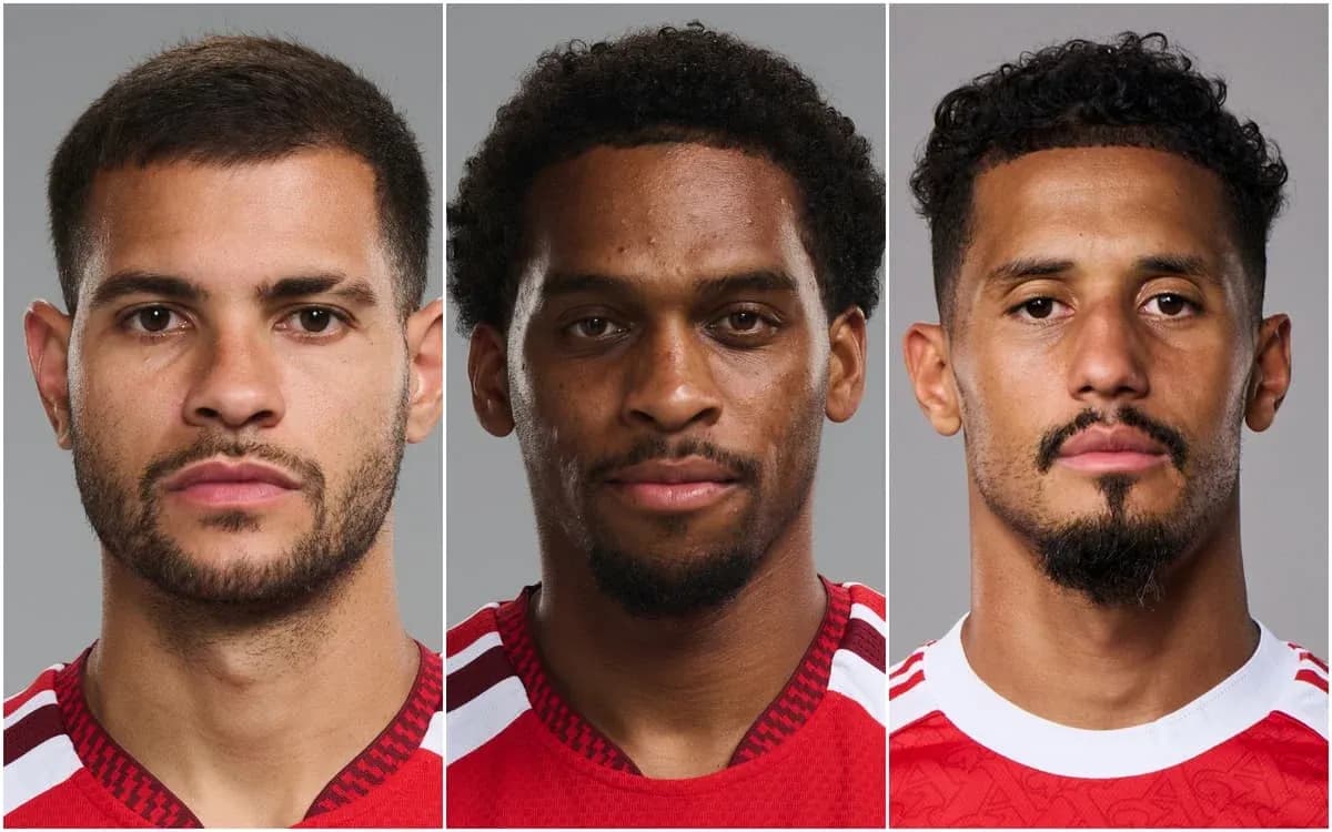 Three football players posing for headshots Three football players posing for headshots