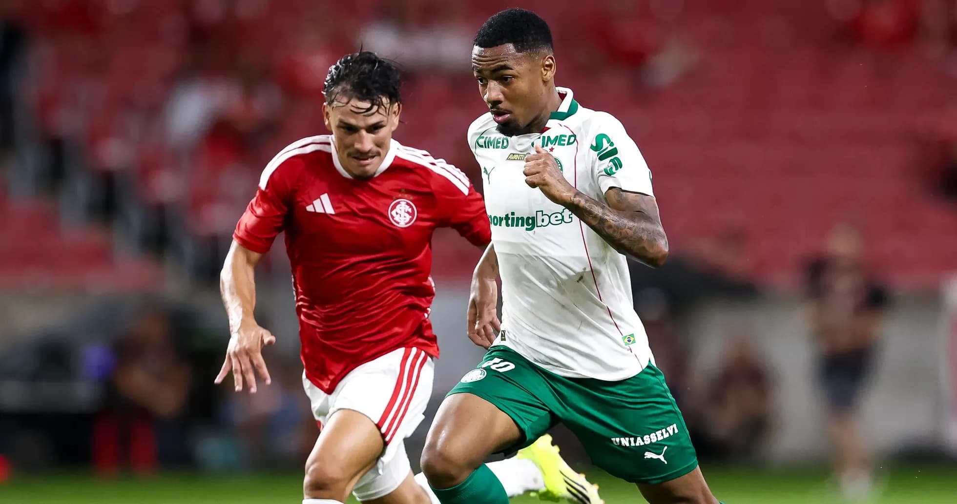 Two players sprinting during a football match Two players sprinting during a football match