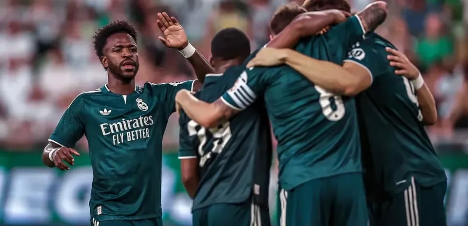 Real Madrid players celebrating a goal Real Madrid players celebrating a goal