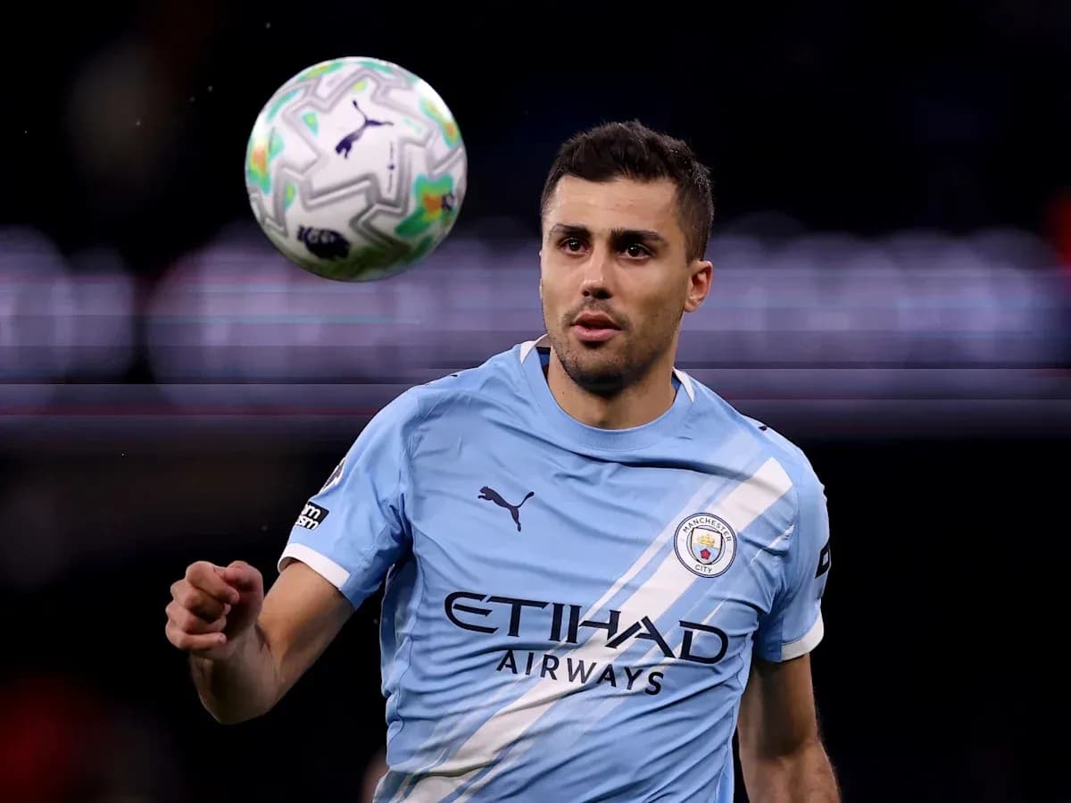 Player in light blue jersey receiving a football Player in light blue jersey receiving a football