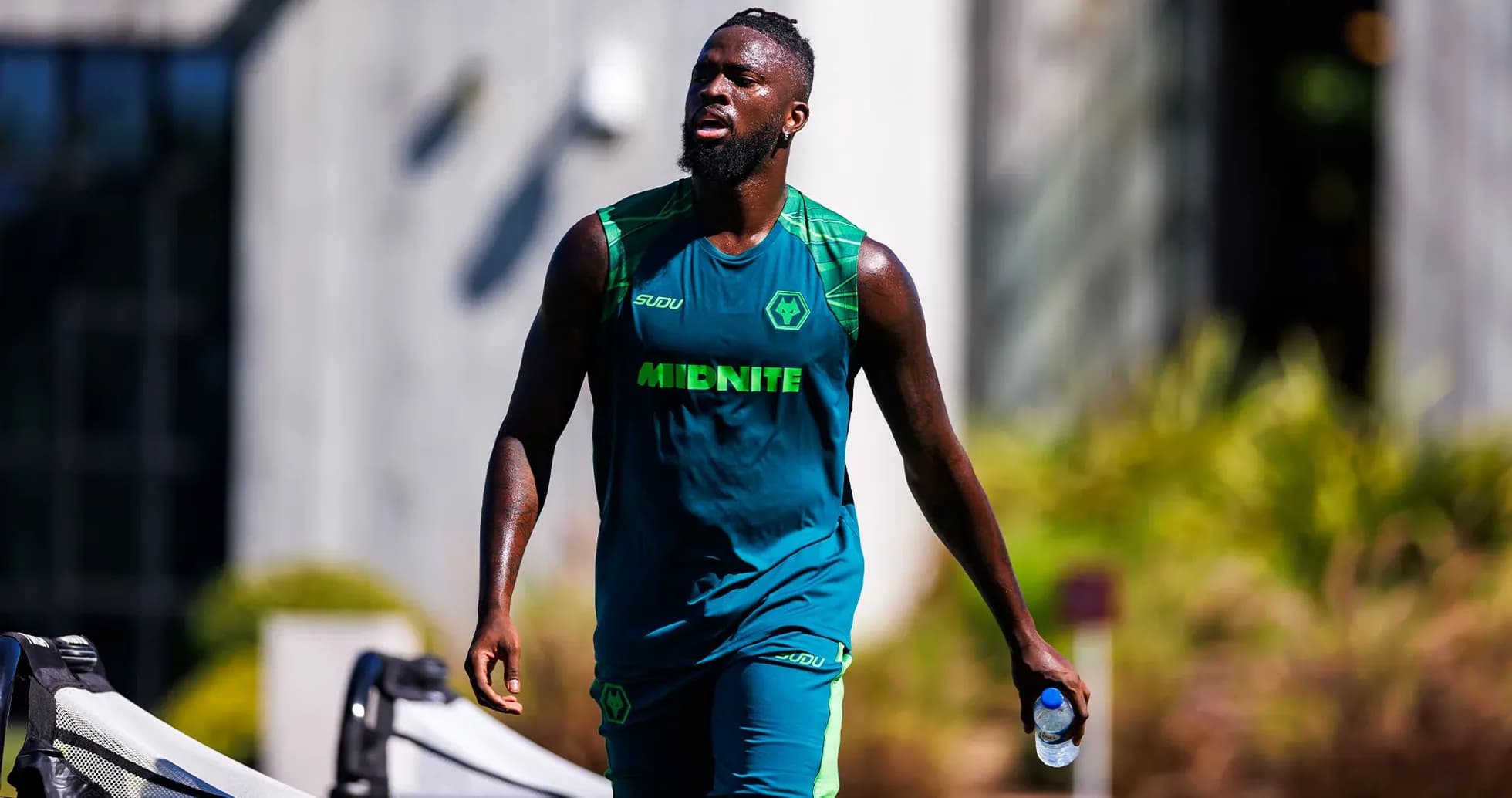 Player walking with water bottle during training session Player walking with water bottle during training session
