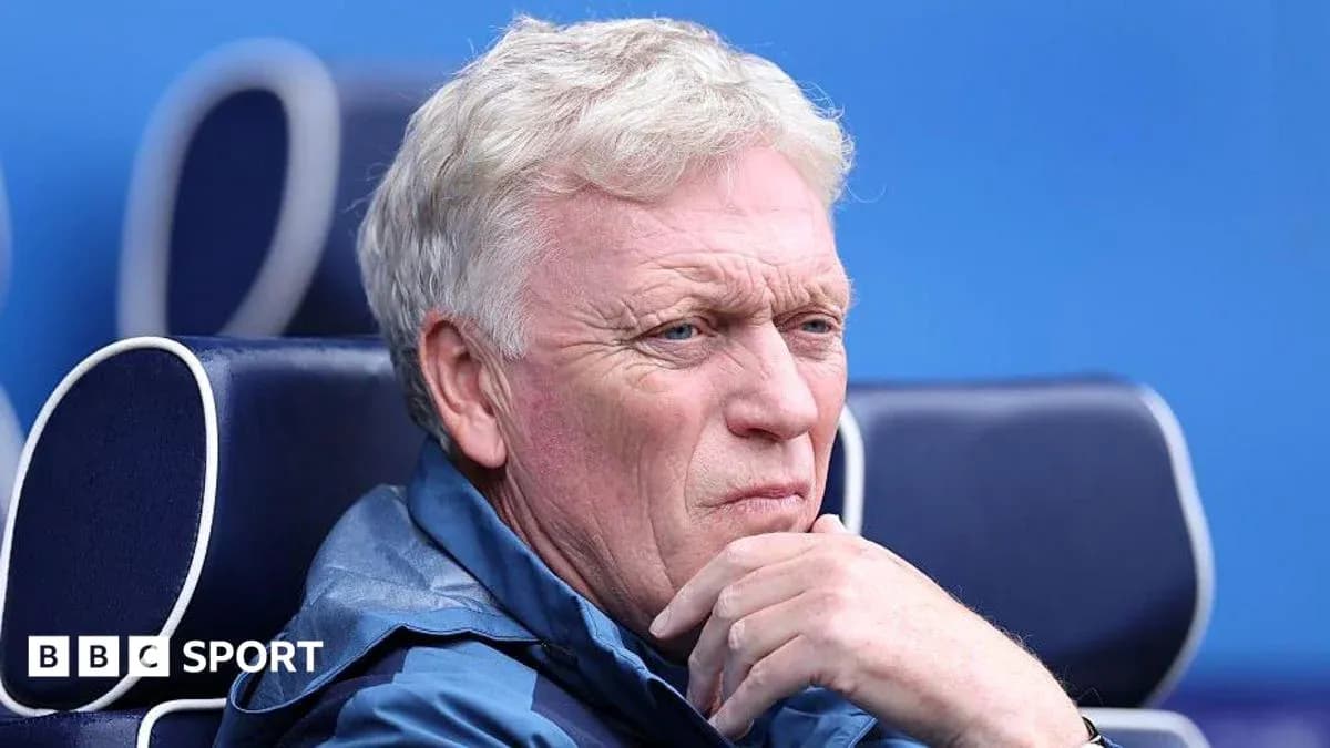 Coach seated on bench during a match Coach seated on bench during a match