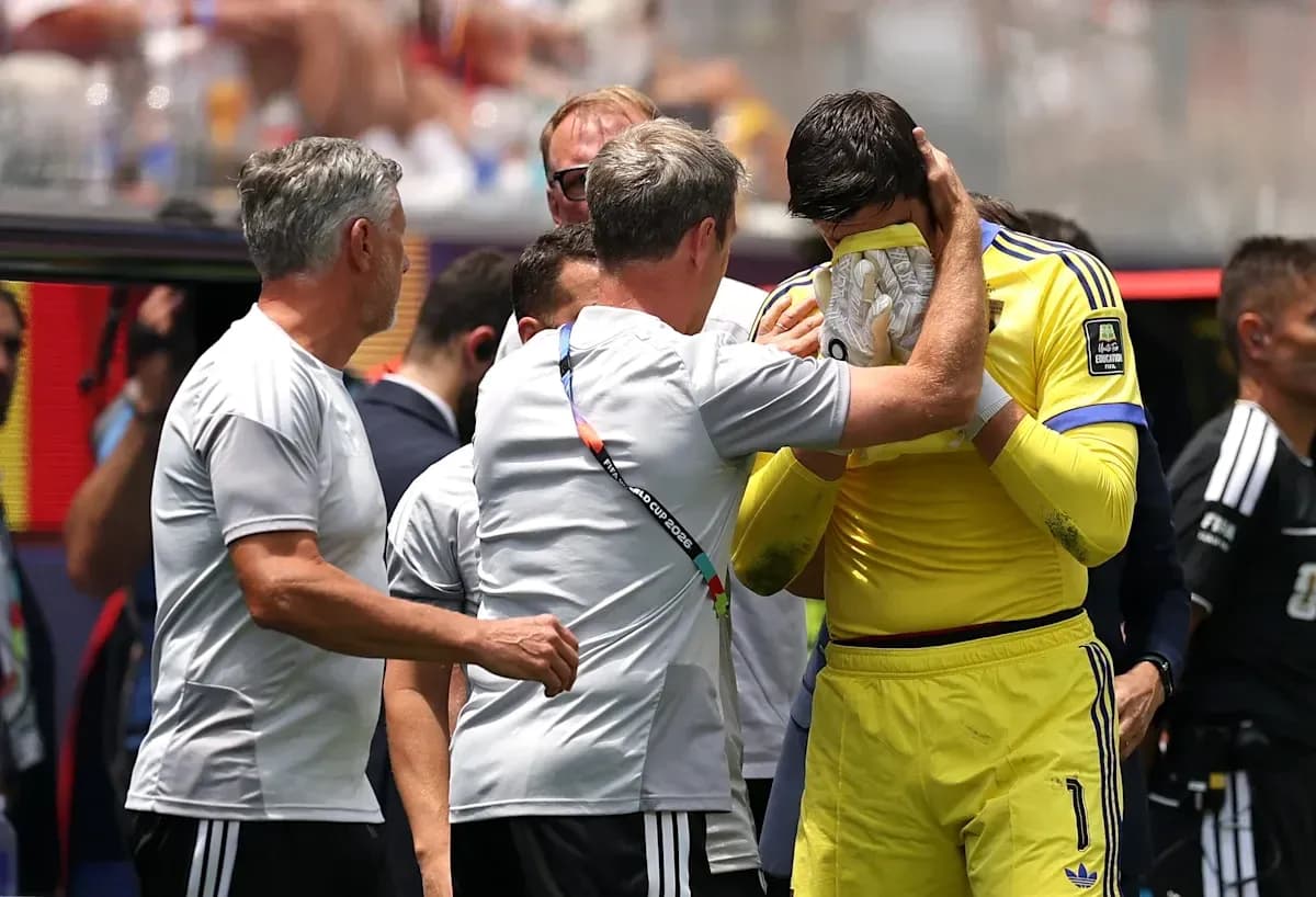 Coach comforting goalkeeper on the sidelines Coach comforting goalkeeper on the sidelines