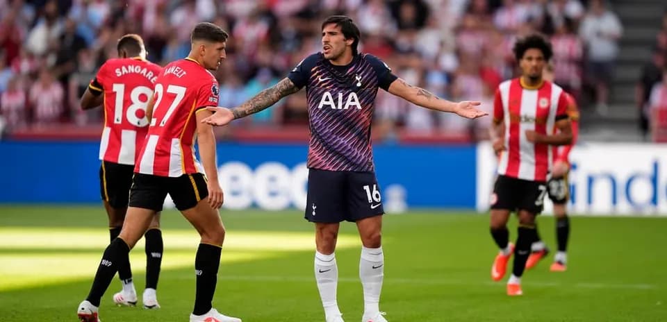 Players disputing a decision during a football match Players disputing a decision during a football match