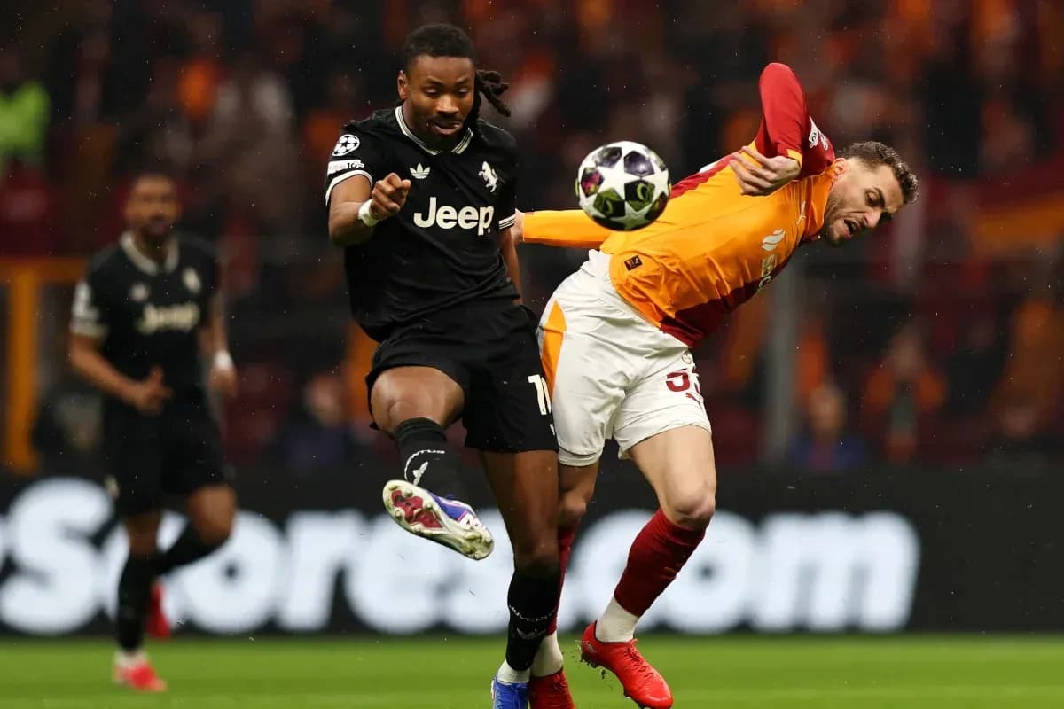 Player kicking ball during intense football match action Player kicking ball during intense football match action