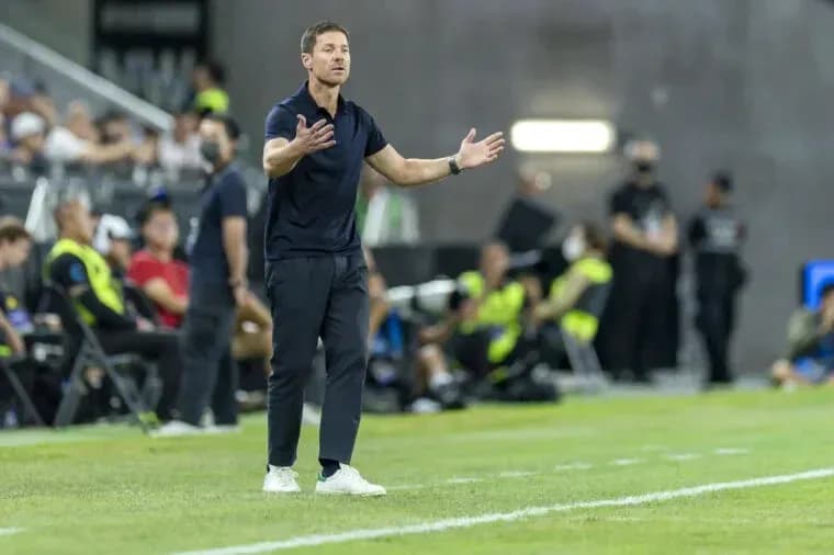 Coach gesturing on the sideline during match Coach gesturing on the sideline during match