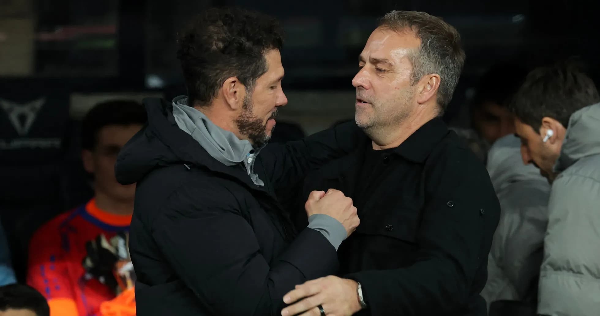 Two coaches greeting each other before the match Two coaches greeting each other before the match