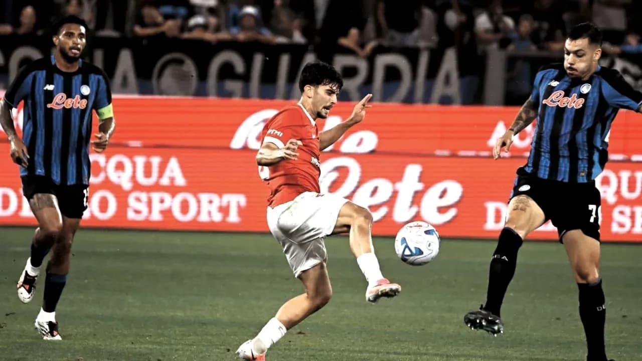 Player kicking the ball during football match action Player kicking the ball during football match action