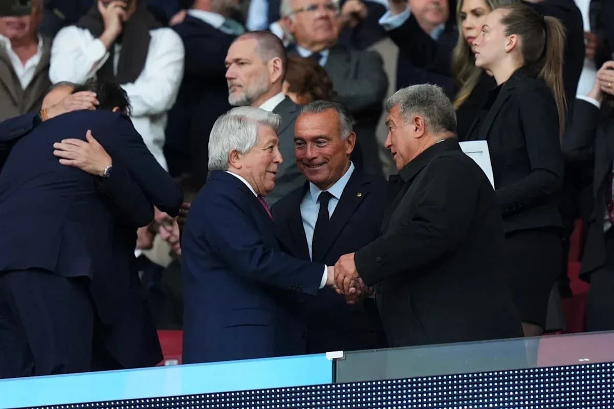 Three men shaking hands in a stadium box Three men shaking hands in a stadium box