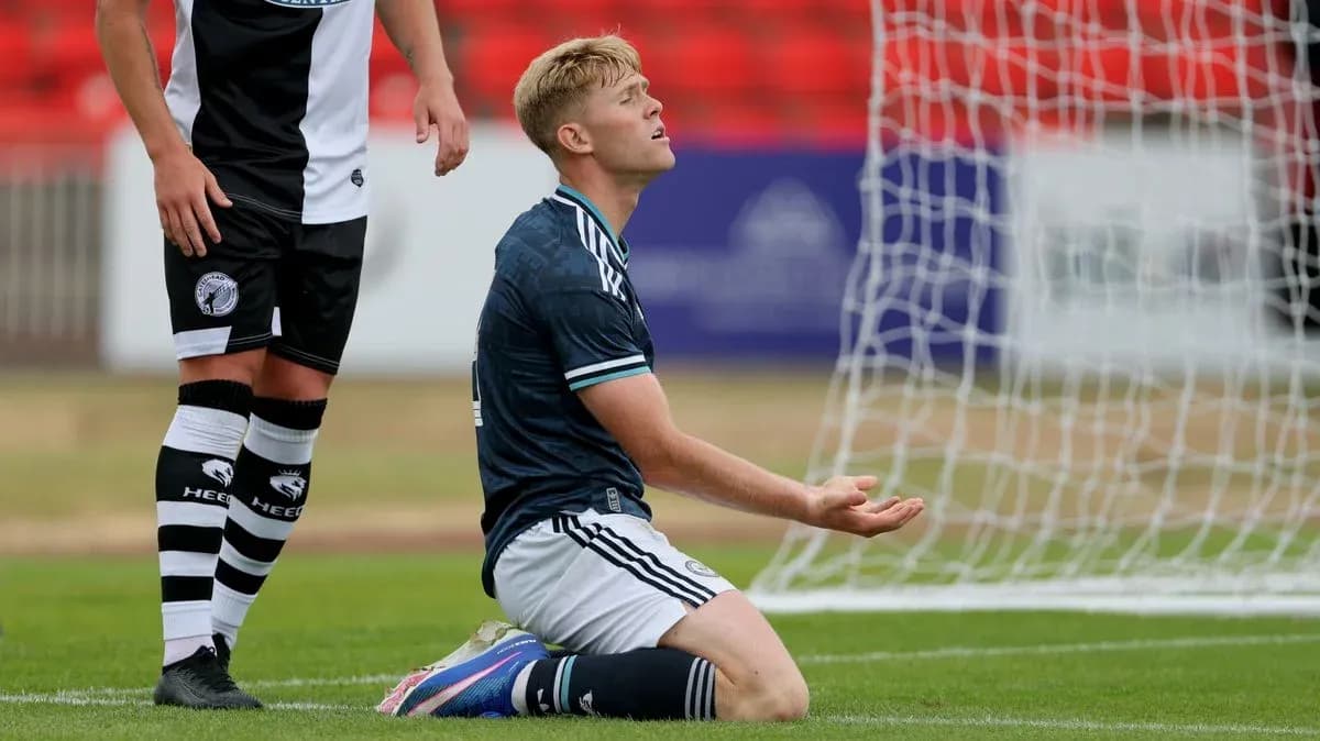 Player kneeling on pitch after missed opportunity Player kneeling on pitch after missed opportunity