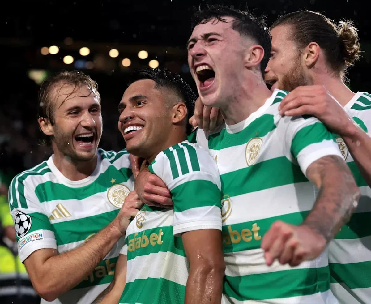 Celtic players celebrating a goal in UEFA match Celtic players celebrating a goal in UEFA match