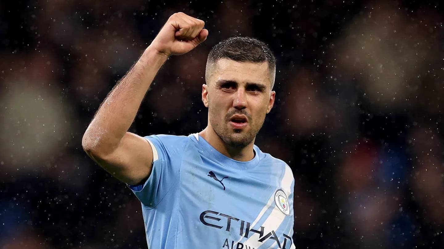 Player celebrating with raised fist on field Player celebrating with raised fist on field