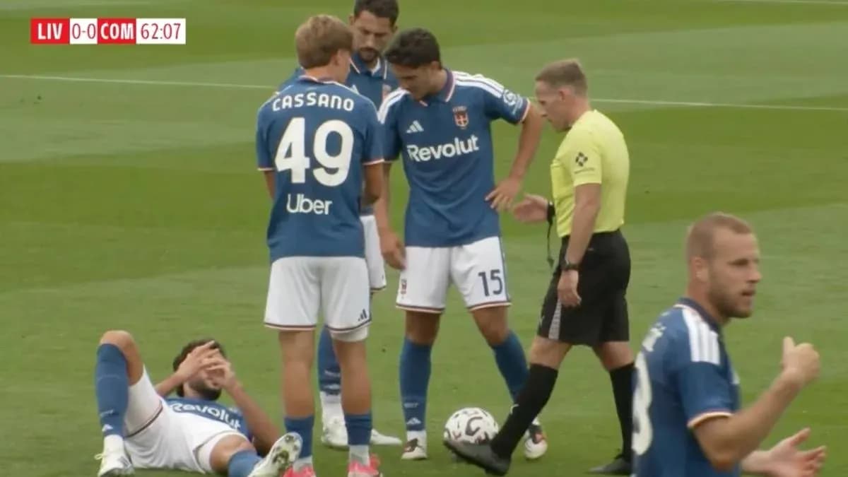 Players gathered around injured teammate on field Players gathered around injured teammate on field