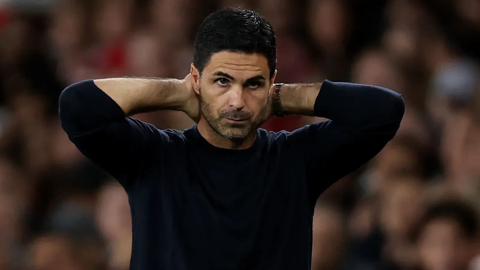 Manager with hands behind head during match Manager with hands behind head during match