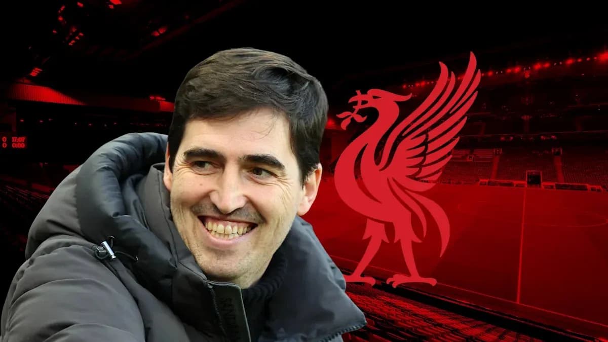 Smiling coach in front of Liverpool stadium backdrop Smiling coach in front of Liverpool stadium backdrop