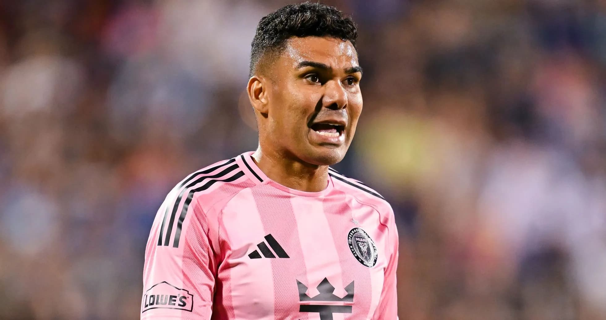 Player in pink jersey shouting during a match Player in pink jersey shouting during a match