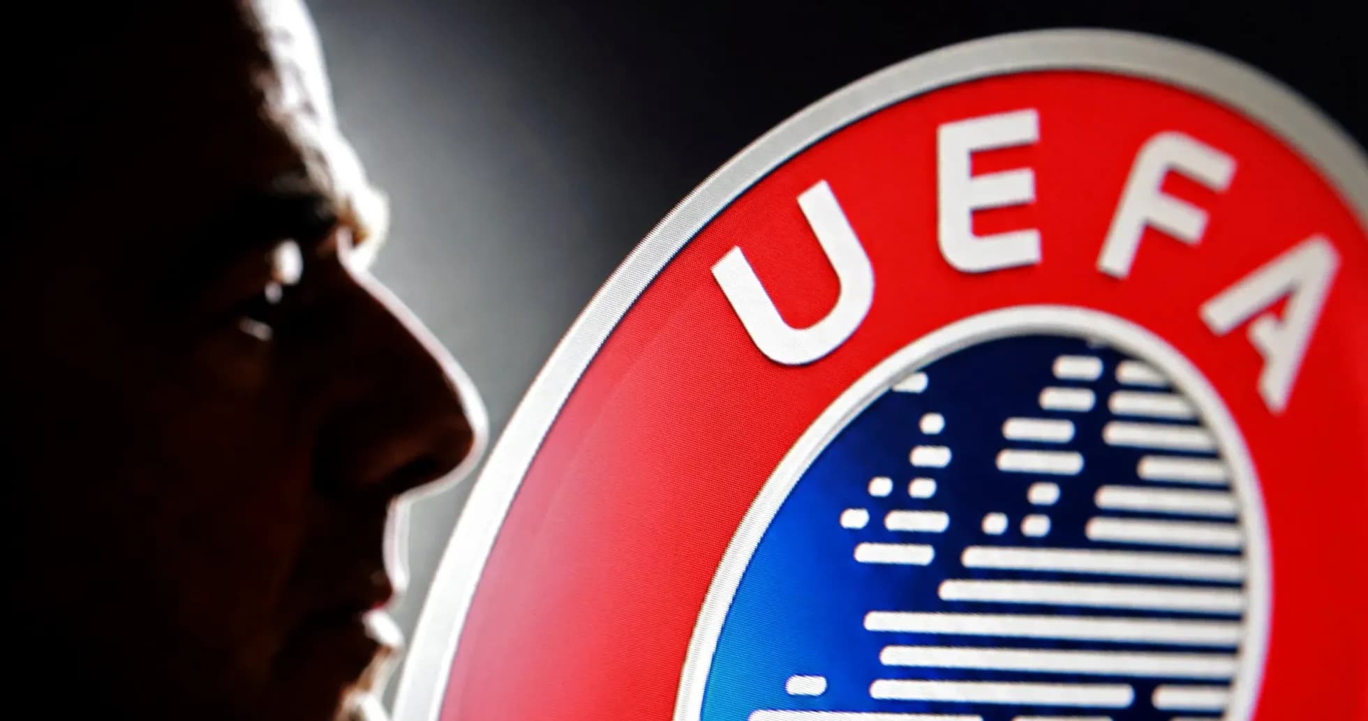 Profile silhouette beside UEFA logo Profile silhouette beside UEFA logo