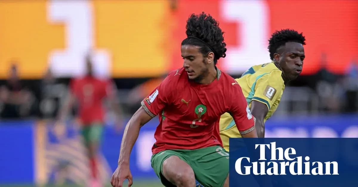 Moroccan player dribbling past opponent during match Moroccan player dribbling past opponent during match