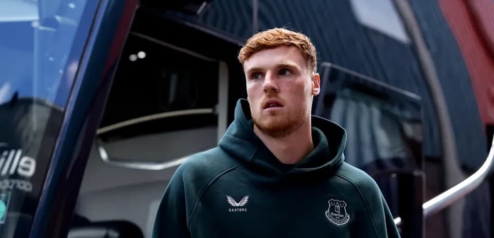 Player in Everton hoodie near team bus Player in Everton hoodie near team bus