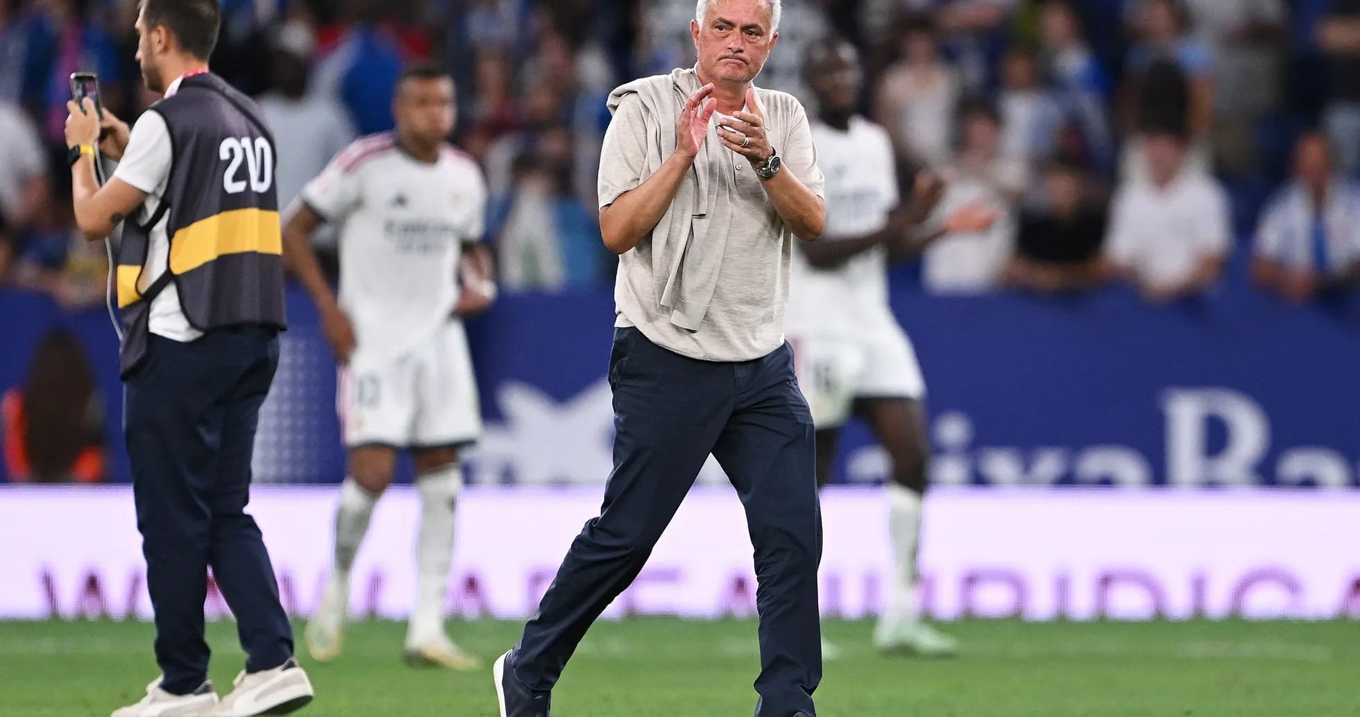 Manager clapping during a football match Manager clapping during a football match