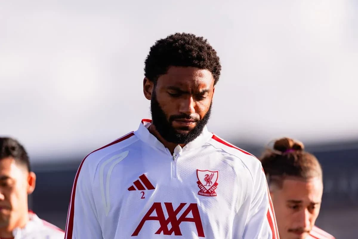 Player in Liverpool FC kit during team moment Player in Liverpool FC kit during team moment