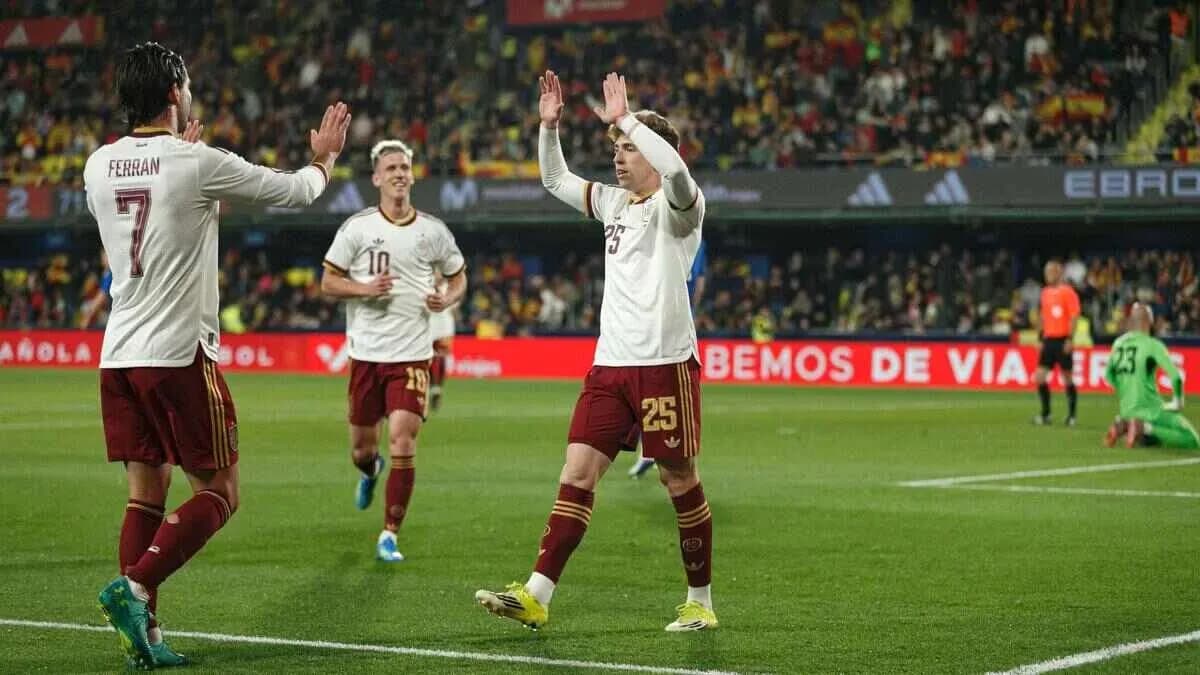Spanish players celebrating a goal during match Spanish players celebrating a goal during match