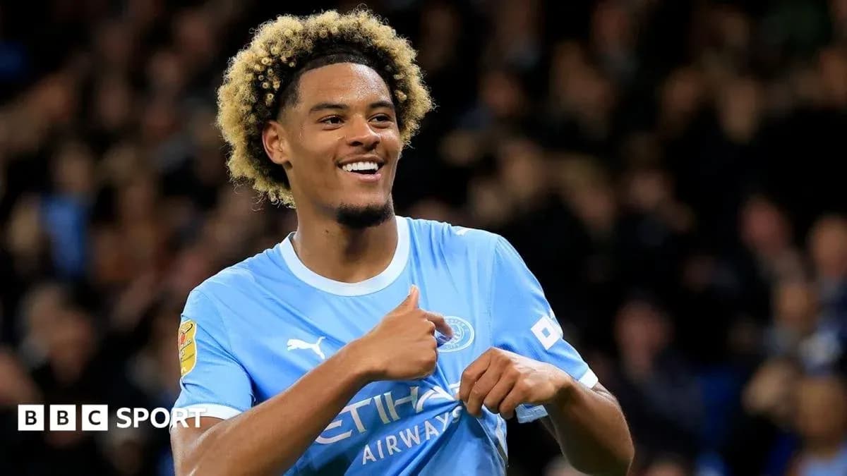 Player celebrating after scoring a goal for Manchester City Player celebrating after scoring a goal for Manchester City