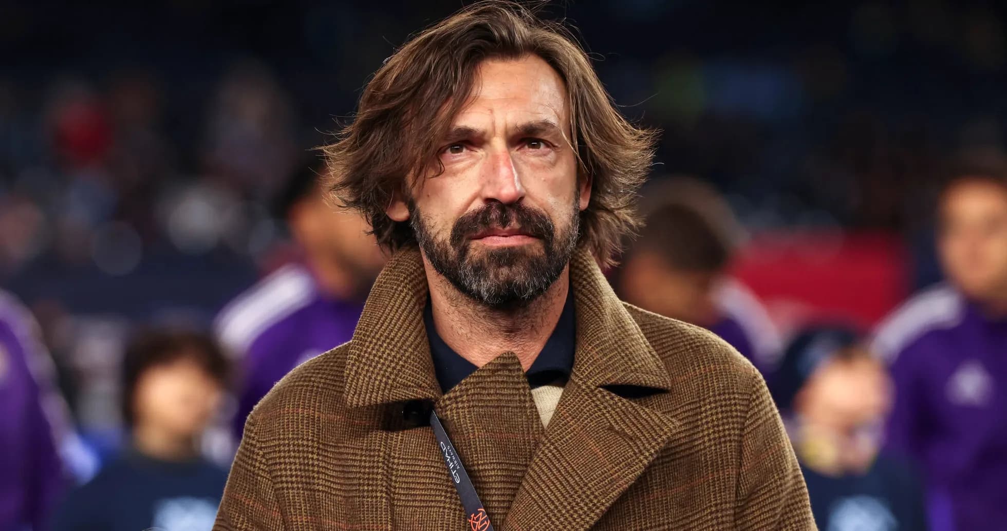 Coach in a brown coat at a sports event Coach in a brown coat at a sports event