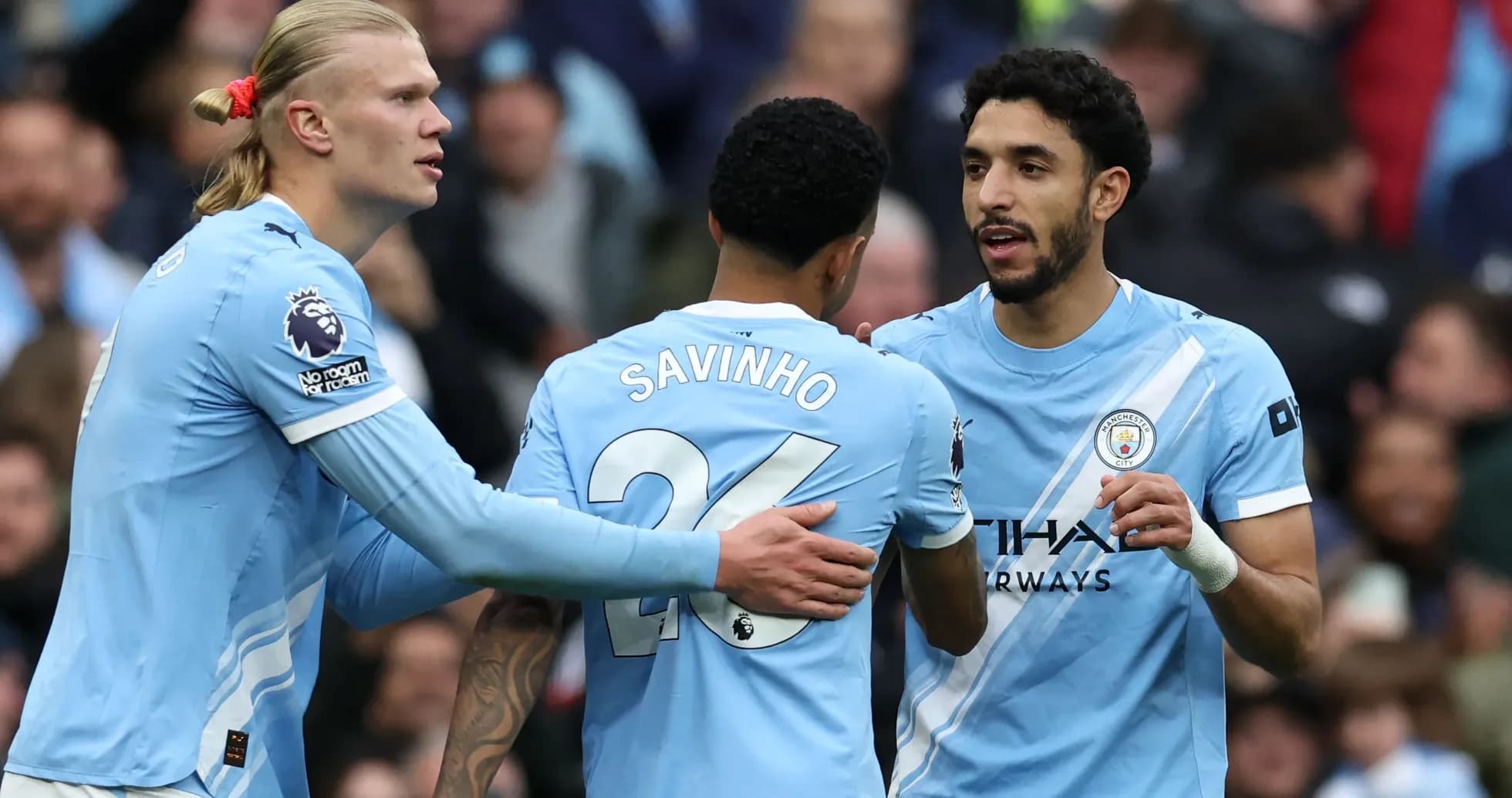 Manchester City players celebrating during a match Manchester City players celebrating during a match